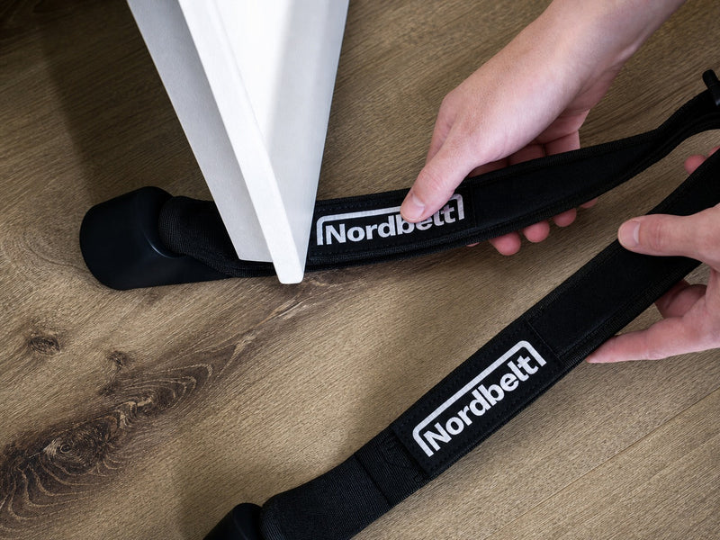 Nordic hamstring curl at home: safe setup with a door, bench or fixed anchor